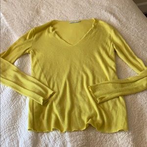 Bright yellow knit blouse